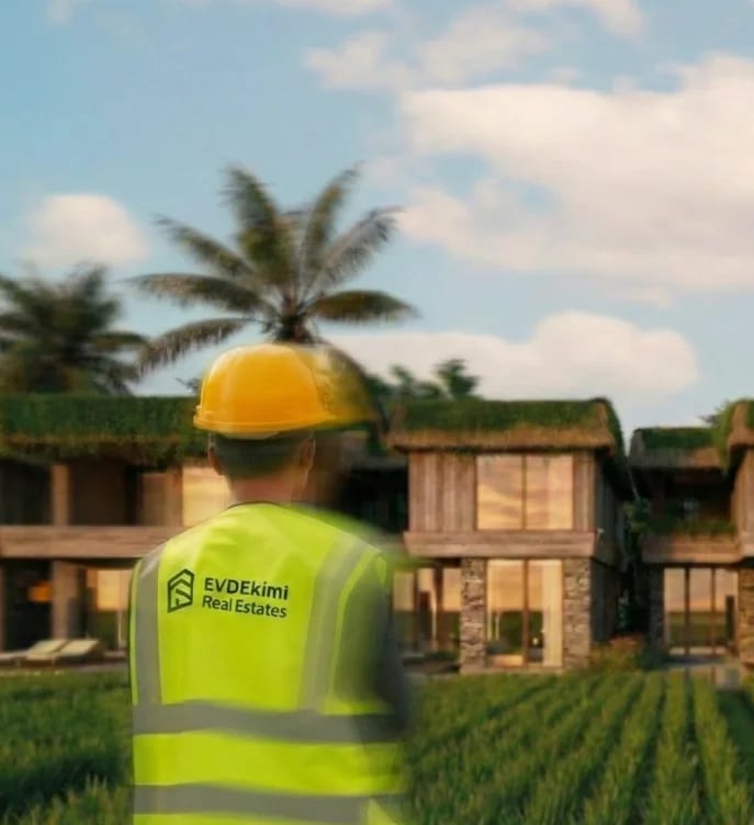 EVDEkimi team member in construction attire at a development site